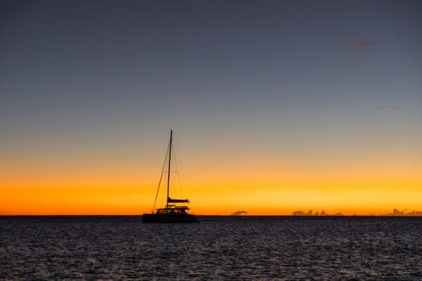 sunset behind yacht in French Polynesia